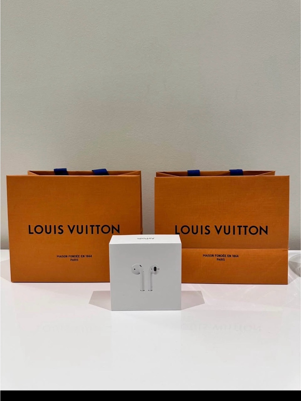 Louis Vuitton Orange Shopping Bags with White Earbuds Box